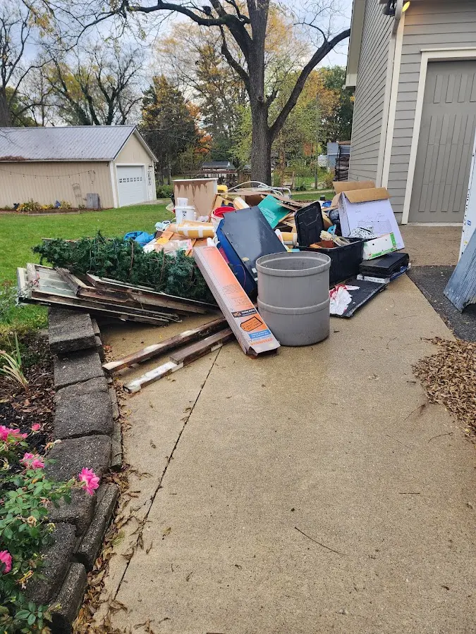Dumpster being loaded with debris for Roofing Dumpster Rental in Monahans